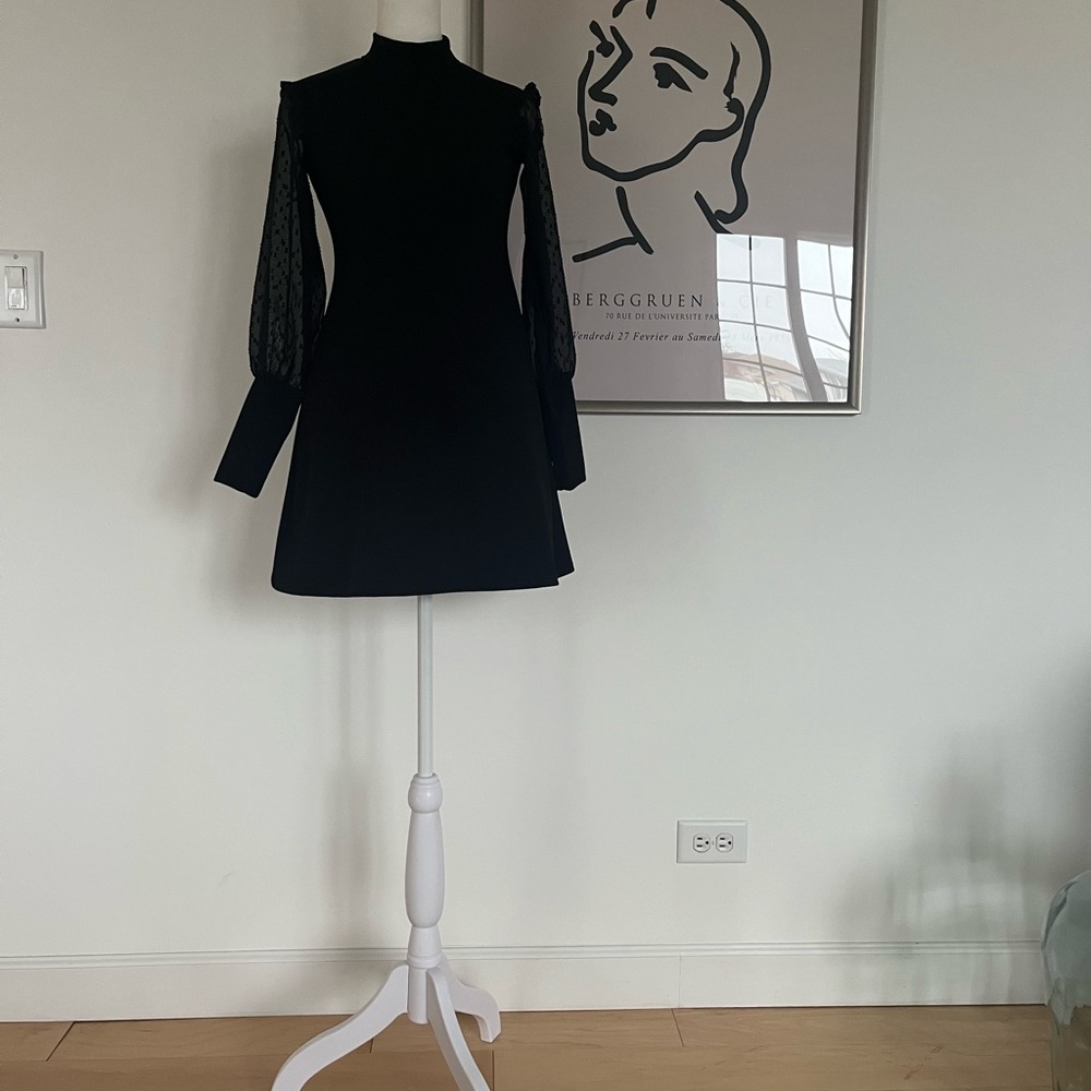 Great dress. Size 11-12 years old. Sheer sleeve.
